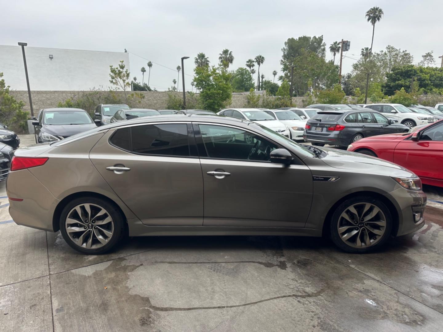 2014 Gray /BLACK Kia Optima SX Turbo (5XXGR4A62EG) with an 2.0L L4 DOHC 16V TURBO engine, 6-Speed Automatic transmission, located at 30 S. Berkeley Avenue, Pasadena, CA, 91107, (626) 248-7567, 34.145447, -118.109398 - New tires! Moon Roof! Nice Interior! Looks and drives good! Bad credit? We can help! We are the bank. All our cars are thoroughly inspected and reconditioned by our technicians. FREE CARFAX report. Stop by or call to speak with our friendly staff. Whether you have bad credit, no credit, bankruptcy, - Photo#5